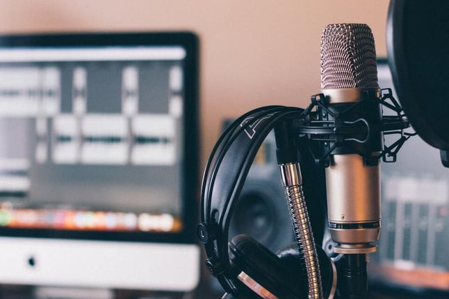 mic and headphones to run a project management podcast