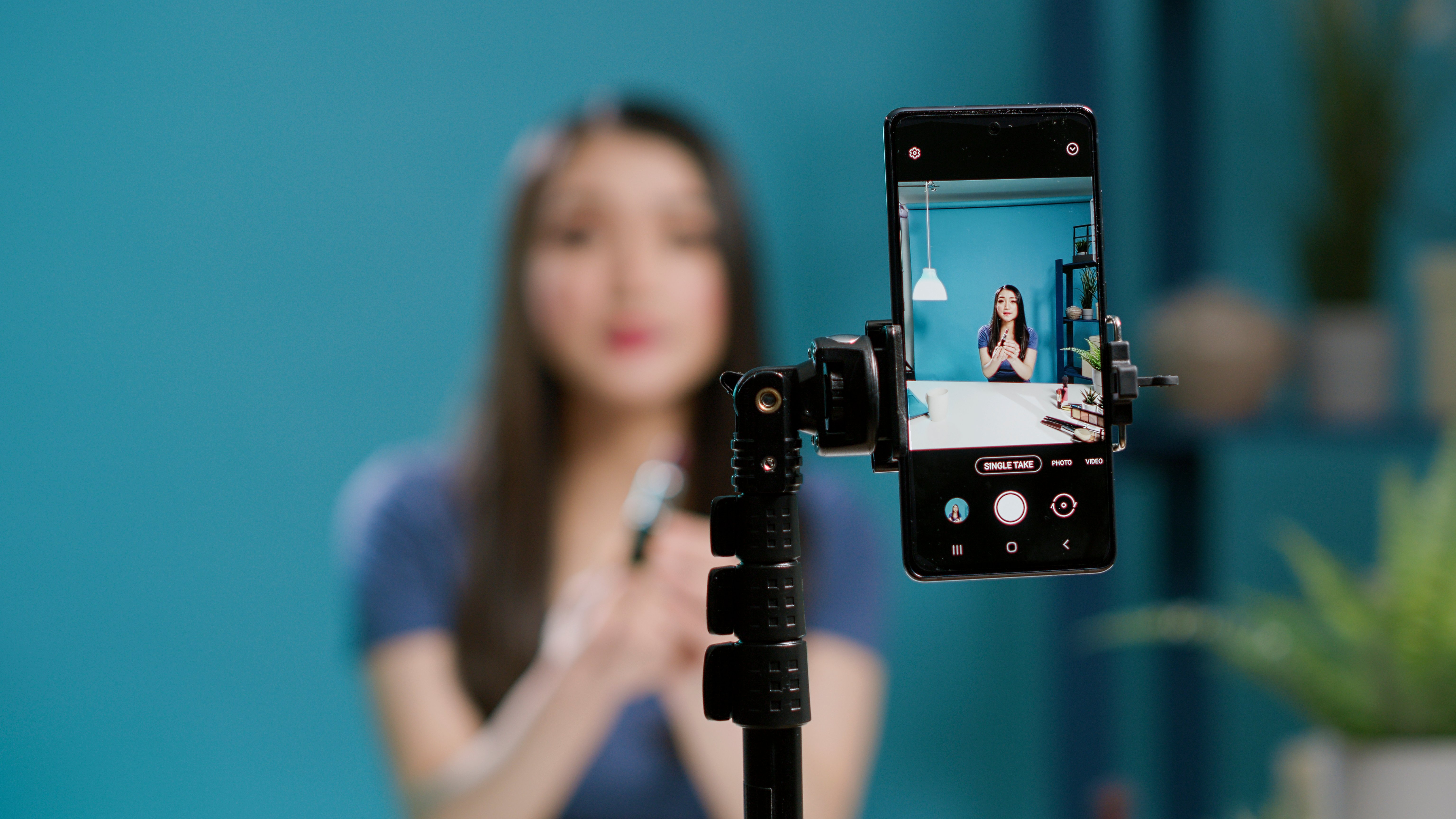 content-creator-recording-lifestyle-vlog-filming-camera-doing-makeup-tutorial-channel-website-female-influencer-broadcasting-live-video-with-beauty-cosmetics-products-close-up